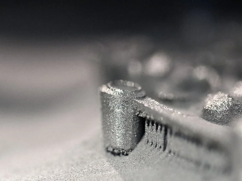 Close up of the grainy details of a metal 3D printed part